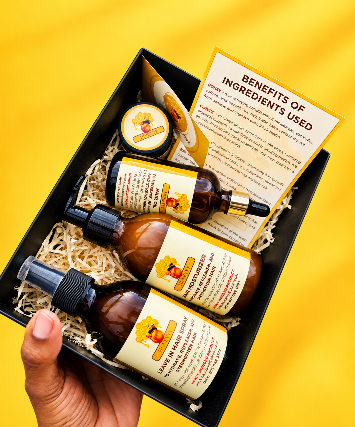 Huneyyy boxed haircare and honey-infused products on a yellow background